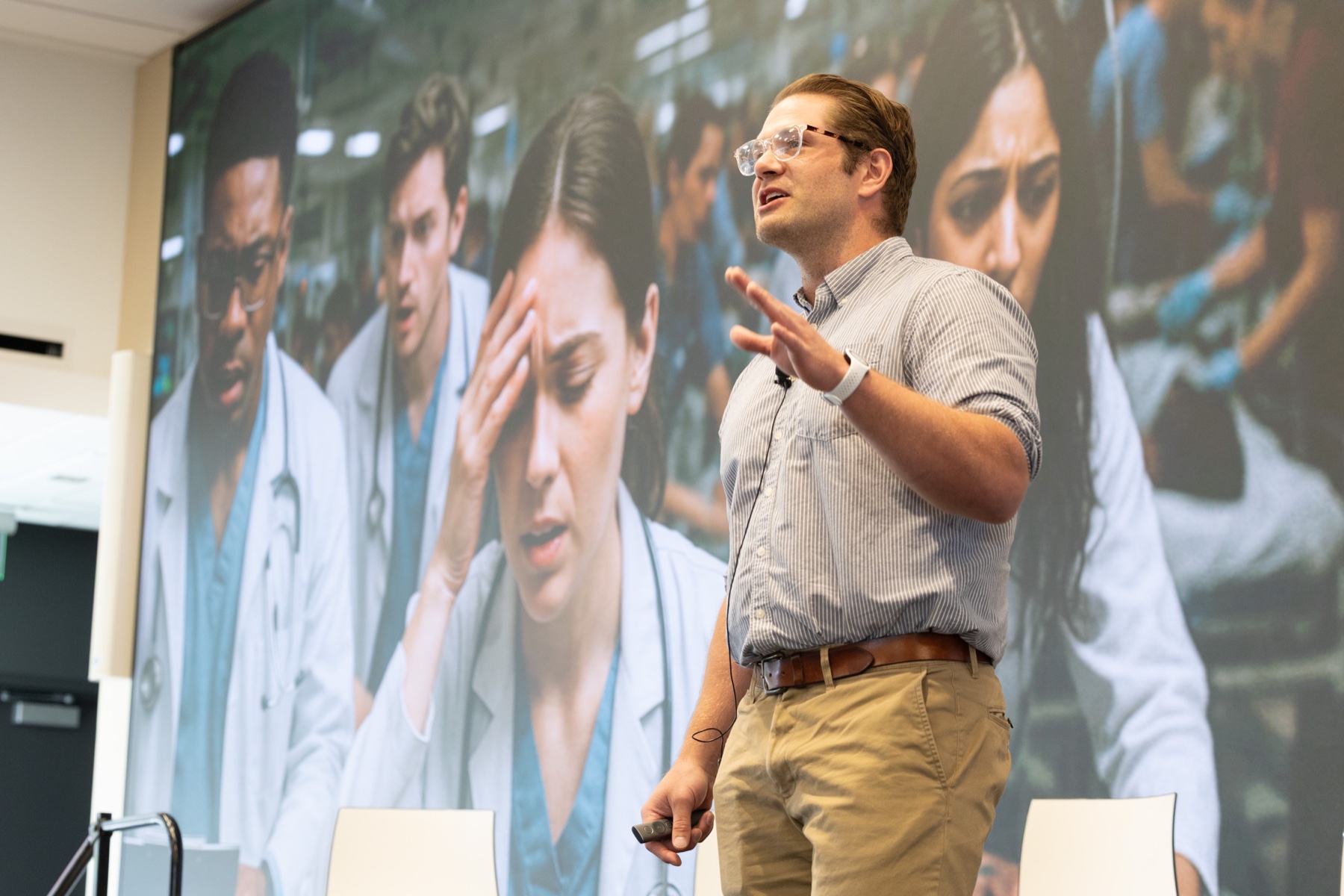 Carl speaking at a medical education symposium